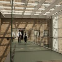 Two physicians walking down a hallway.